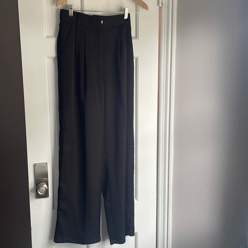 Black satin trousers.